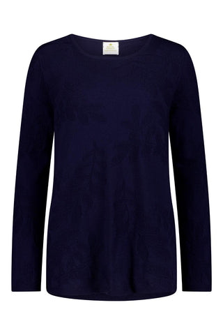 Navy sweater with floral patterns against a white background