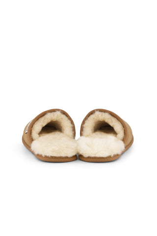 Pair of brown slippers with white sheepskin lining on a white background