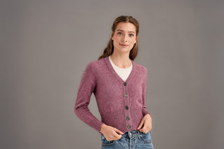 Woman wearing possum merino knit gloves and jumper