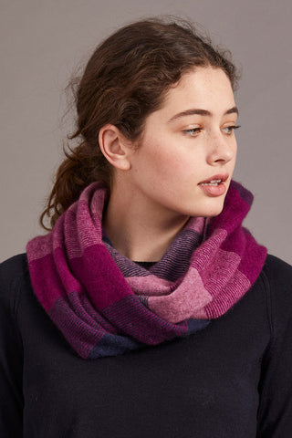 A woman wearing a navy berry and heather snood